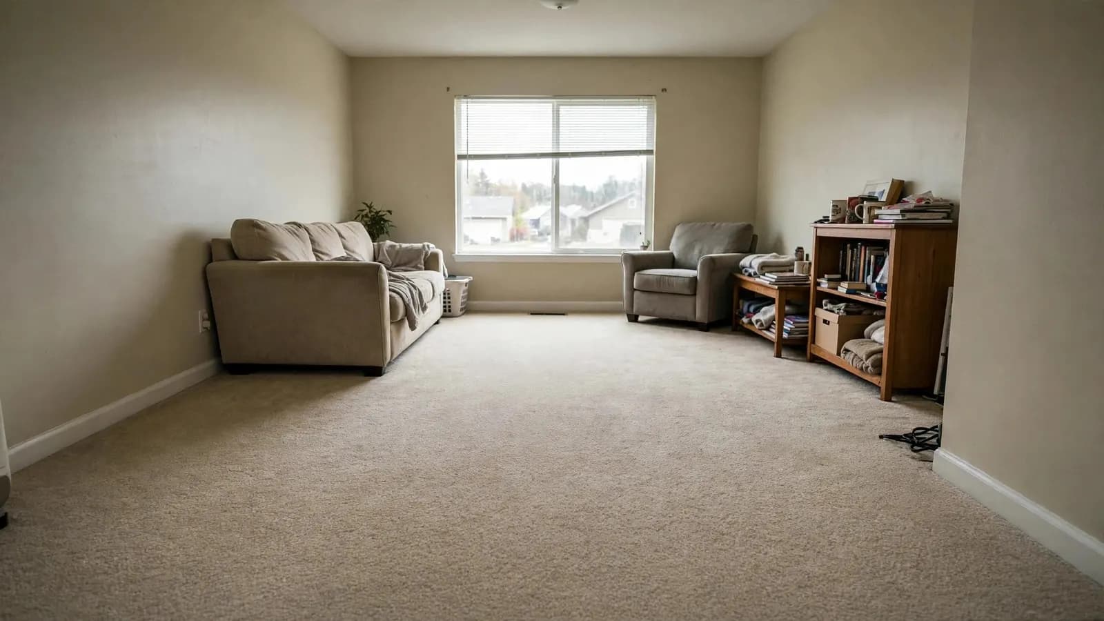 After: living room flooded with standing water, then dried with new carpet